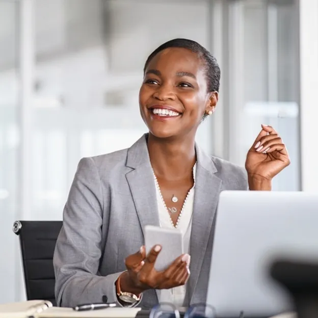 Smiling young professional working on a laptop